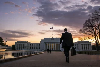 fed adviser dual role ends